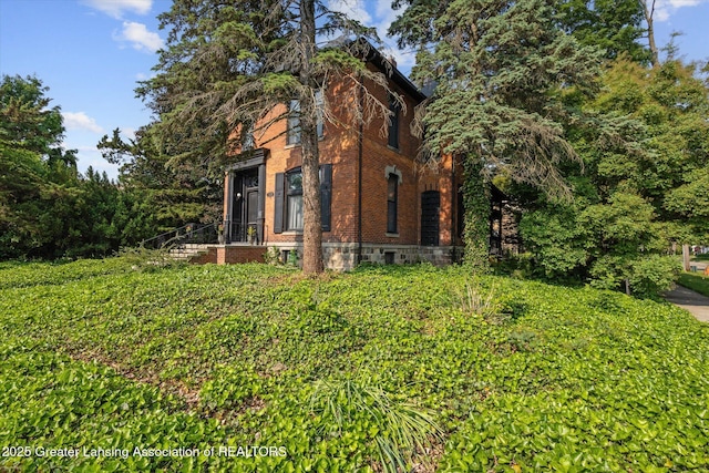 1035 N Capitol Ave, Lansing, MI 48906 - view of side of home with brick siding