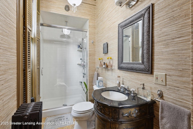 1035 N Capitol Ave, Lansing, MI 48906 - full bathroom with radiator heating unit, a stall shower, vanity, and tasteful backsplash