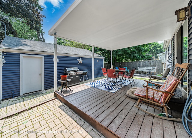 3701 Jerree St, Lansing, MI 48911 - wooden deck with outdoor dining area and grilling area
