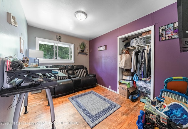 3701 Jerree St, Lansing, MI 48911 - living room featuring wood finished floors and an office area