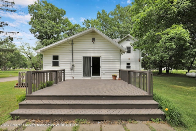 8767 Corrison Rd, Grand Ledge, MI 48837 - back of house with a wooden deck and a yard
