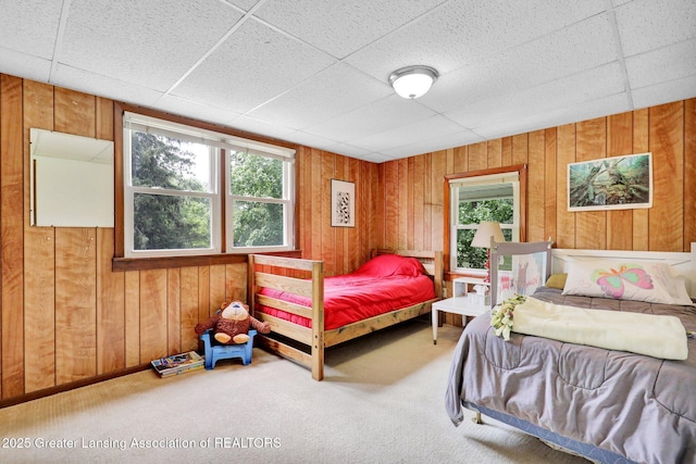 8767 Corrison Rd, Grand Ledge, MI 48837 - carpeted bedroom with multiple windows and wooden walls