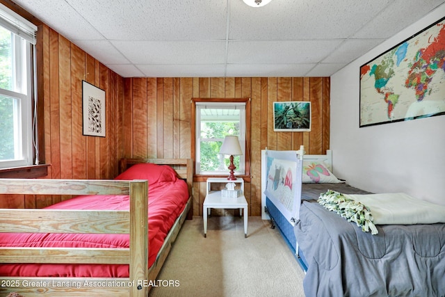 8767 Corrison Rd, Grand Ledge, MI 48837 - bedroom with multiple windows, wood walls, carpet floors, and a drop ceiling