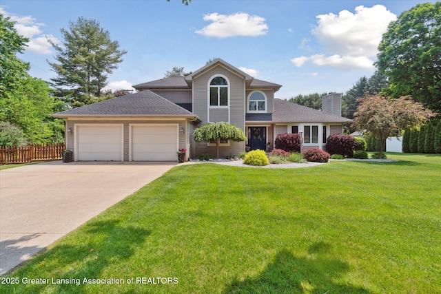 2020 Sunset Dr, Owosso, MI 48867 - traditional home featuring a garage, a chimney, concrete driveway, and a shingled roof