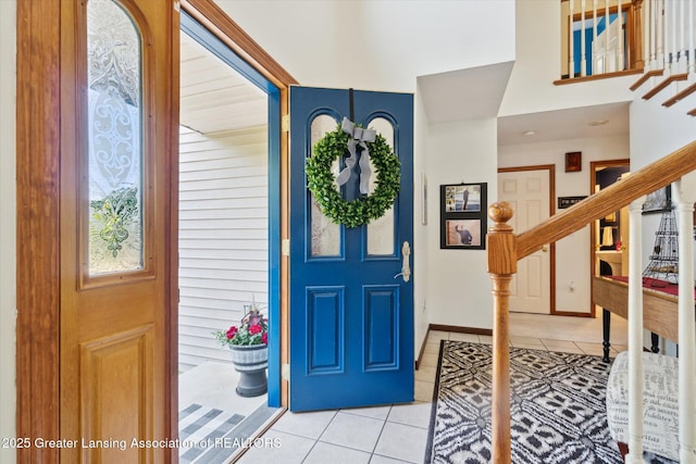 2020 Sunset Dr, Owosso, MI 48867 - foyer featuring light tile patterned floors and stairway