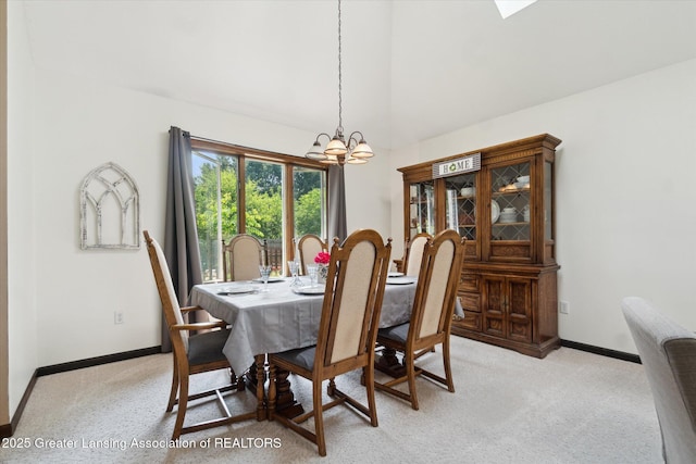 2020 Sunset Dr, Owosso, MI 48867 - dining room featuring a chandelier, vaulted ceiling, and light colored carpet