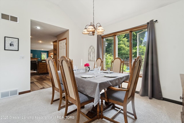 2020 Sunset Dr, Owosso, MI 48867 - dining area with a chandelier, lofted ceiling, recessed lighting, and light colored carpet