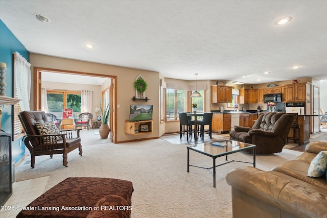 2020 Sunset Dr, Owosso, MI 48867 - living room featuring recessed lighting and light colored carpet