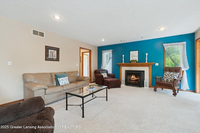 2020 Sunset Dr, Owosso, MI 48867 - carpeted living room featuring a fireplace with flush hearth and recessed lighting