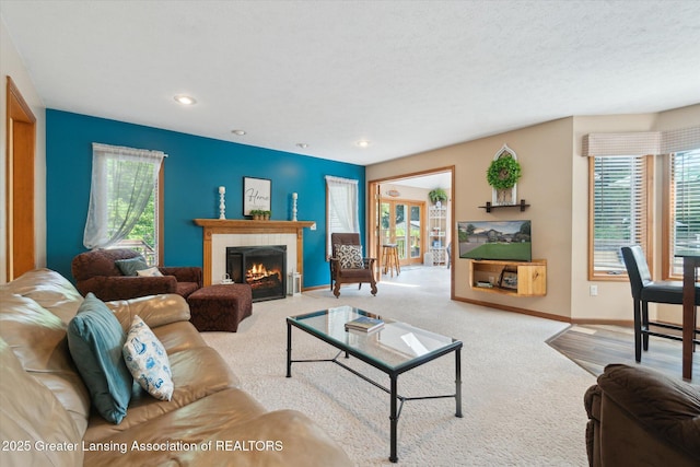 2020 Sunset Dr, Owosso, MI 48867 - carpeted living area featuring plenty of natural light, a fireplace, and recessed lighting