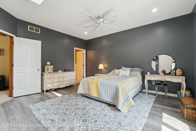 2020 Sunset Dr, Owosso, MI 48867 - bedroom with wood finished floors, ceiling fan, and recessed lighting
