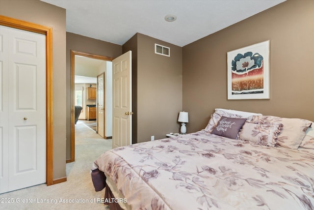 2020 Sunset Dr, Owosso, MI 48867 - bedroom with light carpet and baseboards