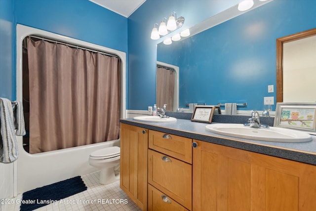 2020 Sunset Dr, Owosso, MI 48867 - bathroom featuring double vanity, tile patterned floors, and shower / tub combo