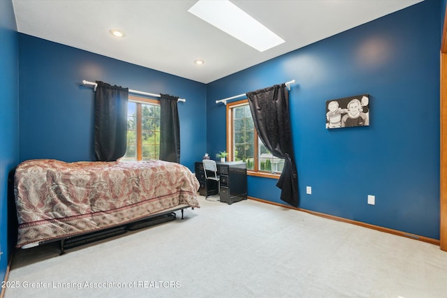 2020 Sunset Dr, Owosso, MI 48867 - bedroom with carpet flooring, multiple windows, recessed lighting, and a skylight