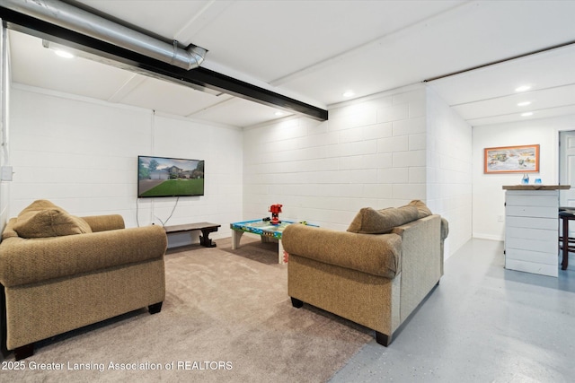 2020 Sunset Dr, Owosso, MI 48867 - living room featuring concrete block wall and recessed lighting