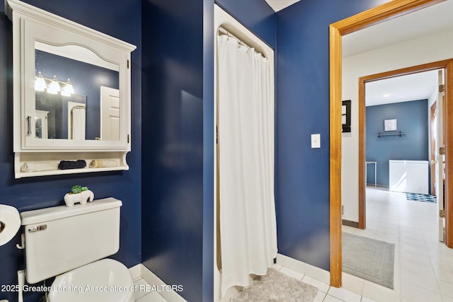2020 Sunset Dr, Owosso, MI 48867 - bathroom featuring toilet and tile patterned flooring