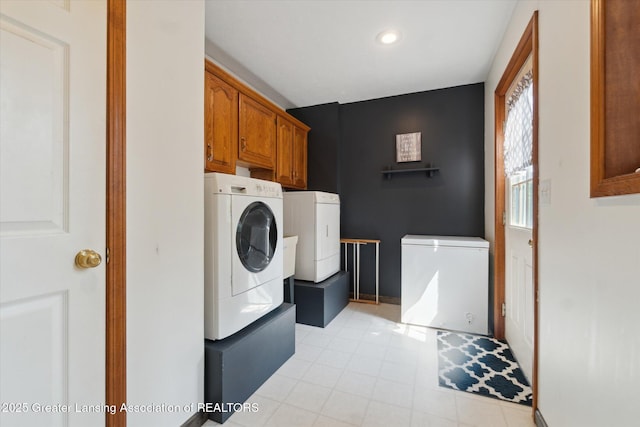 2020 Sunset Dr, Owosso, MI 48867 - laundry area featuring independent washer and dryer, cabinet space, recessed lighting, and light tile patterned floors