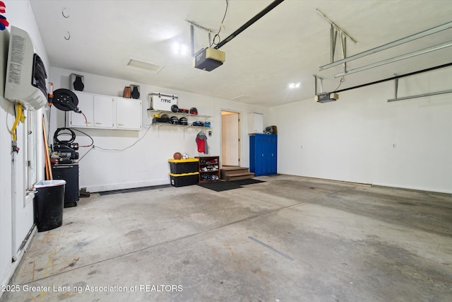 2020 Sunset Dr, Owosso, MI 48867 - garage with a garage door opener