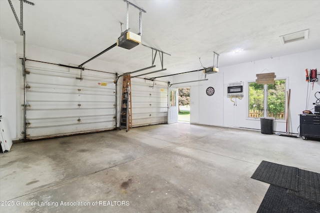 2020 Sunset Dr, Owosso, MI 48867 - garage featuring a garage door opener