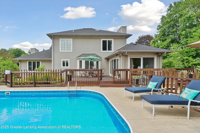 2020 Sunset Dr, Owosso, MI 48867 - view of pool with a wooden deck