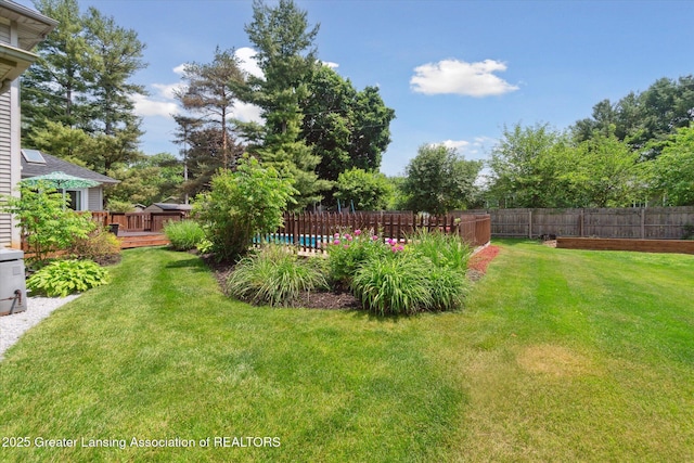 2020 Sunset Dr, Owosso, MI 48867 - view of yard featuring a deck