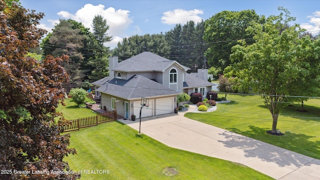2020 Sunset Dr, Owosso, MI 48867 - view of front facade with a chimney, a garage, and driveway