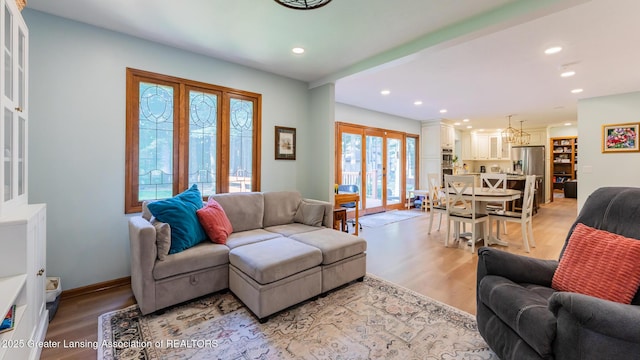 1117 Windreef Cir, Okemos, MI 48864 - living room featuring light wood-type flooring and recessed lighting
