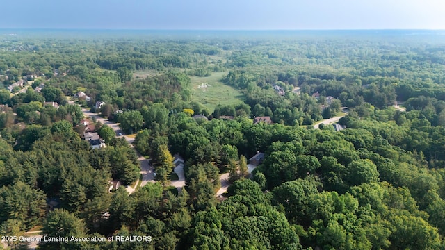1117 Windreef Cir, Okemos, MI 48864 - aerial view of property and surrounding area with a heavily wooded area