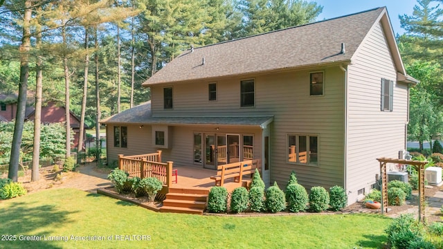 1117 Windreef Cir, Okemos, MI 48864 - back of property with a deck, a lawn, and a shingled roof