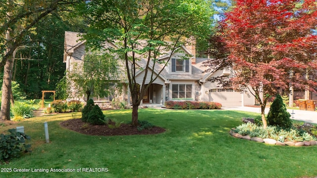 1117 Windreef Cir, Okemos, MI 48864 - view of front of home featuring concrete driveway, a front yard, and a garage