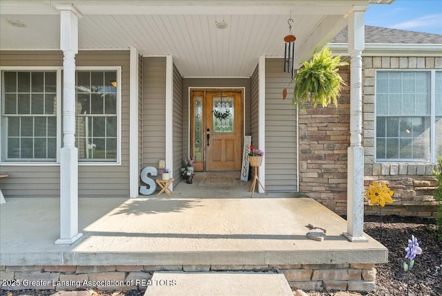 4905 E Green Rd, Saint Johns, MI 48879 - property entrance with a porch and a shingled roof