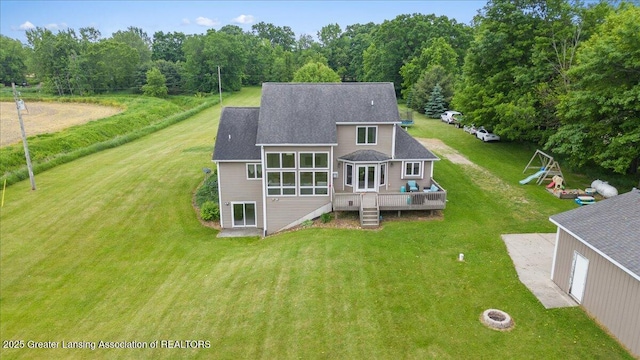 4905 E Green Rd, Saint Johns, MI 48879 - rear view of house featuring a wooden deck, a yard, roof with shingles, and stairs