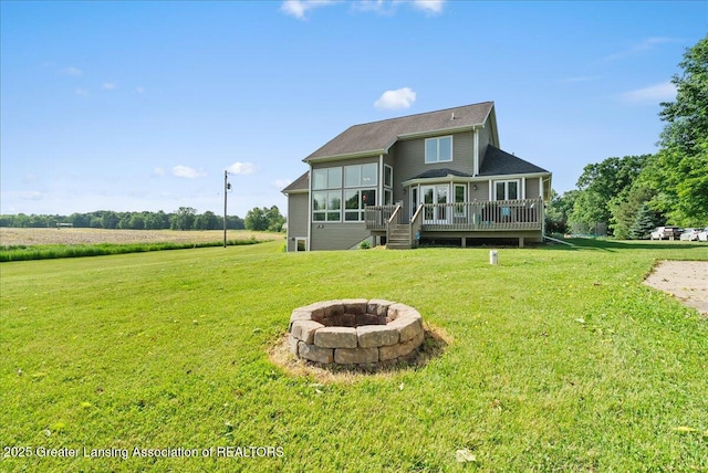 4905 E Green Rd, Saint Johns, MI 48879 - back of house with an outdoor fire pit, a wooden deck, a yard, and stairway