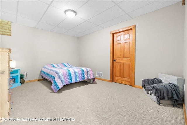 4905 E Green Rd, Saint Johns, MI 48879 - carpeted bedroom with baseboards and a paneled ceiling