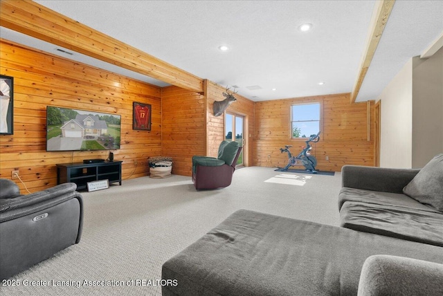4905 E Green Rd, Saint Johns, MI 48879 - carpeted living area with wooden walls, beam ceiling, and recessed lighting