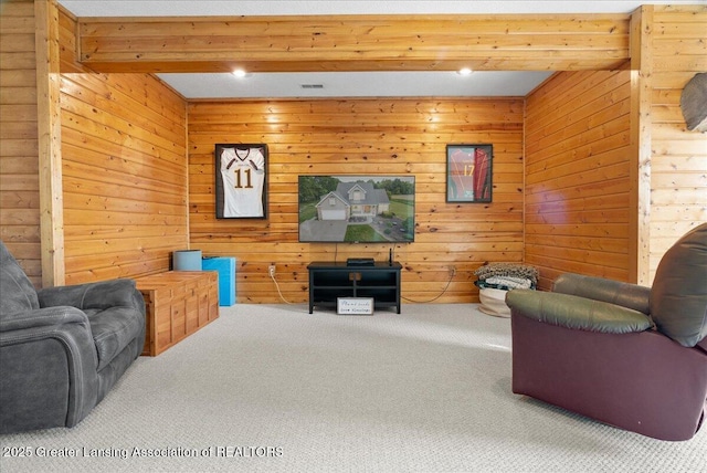 4905 E Green Rd, Saint Johns, MI 48879 - carpeted living area with beam ceiling and wooden walls