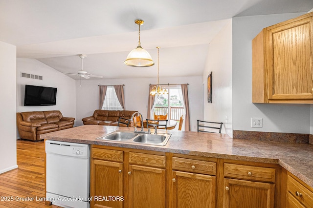 1262 Evans St, Mason, MI 48854 - kitchen featuring dishwasher, lofted ceiling, a peninsula, a ceiling fan, and wood finished floors