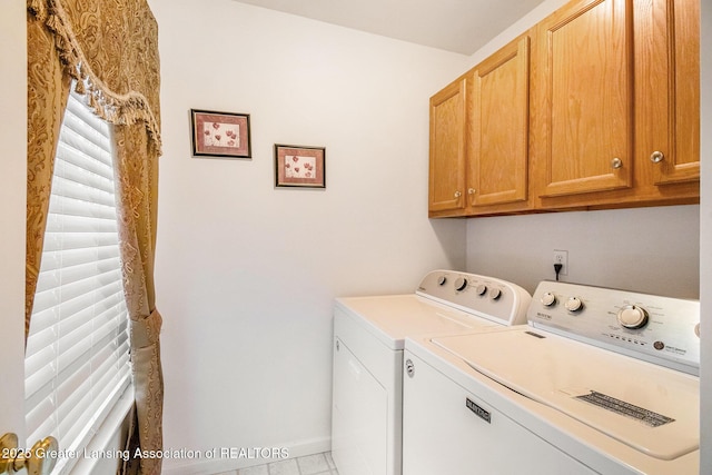 1262 Evans St, Mason, MI 48854 - laundry area featuring cabinet space and washing machine and clothes dryer