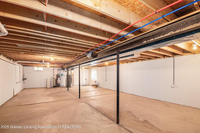 1262 Evans St, Mason, MI 48854 - basement with a water softener system, heating unit, and water heater