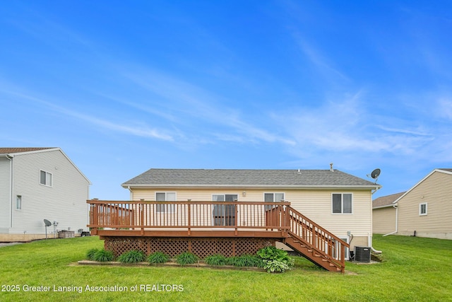 1262 Evans St, Mason, MI 48854 - back of property featuring a wooden deck, a yard, and stairs