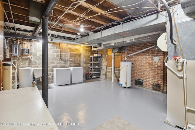 350 N Marshall Ave, Marshall, MI 49068 - unfinished below grade area with water heater, heating unit, and refrigerator