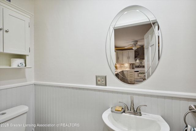 350 N Marshall Ave, Marshall, MI 49068 - half bath featuring wainscoting and a ceiling fan