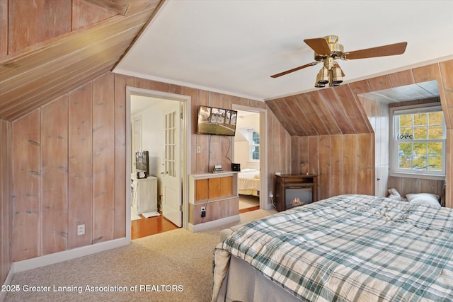 350 N Marshall Ave, Marshall, MI 49068 - carpeted bedroom featuring wooden walls and vaulted ceiling