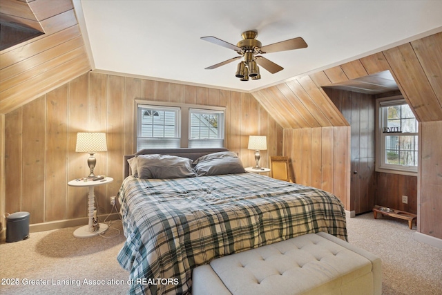 350 N Marshall Ave, Marshall, MI 49068 - bedroom featuring carpet floors, wood walls, vaulted ceiling, and a ceiling fan