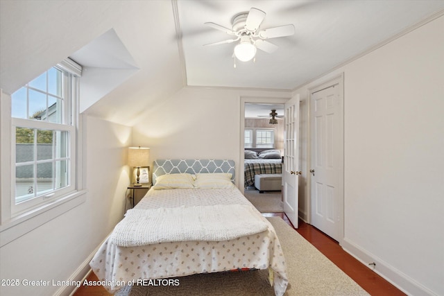 350 N Marshall Ave, Marshall, MI 49068 - bedroom with ceiling fan, vaulted ceiling, and dark wood-type flooring