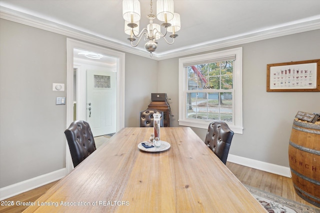 350 N Marshall Ave, Marshall, MI 49068 - dining room with a chandelier, wood finished floors, and ornamental molding