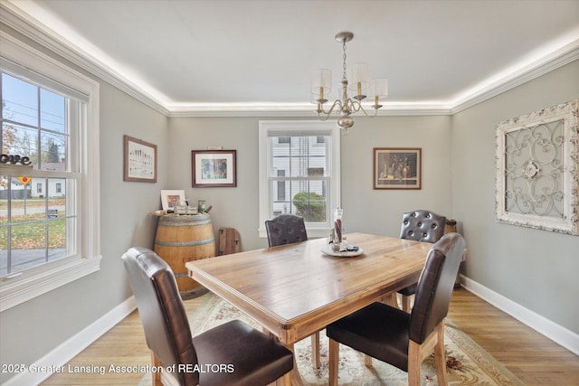 350 N Marshall Ave, Marshall, MI 49068 - dining room with a chandelier, light wood finished floors, and crown molding