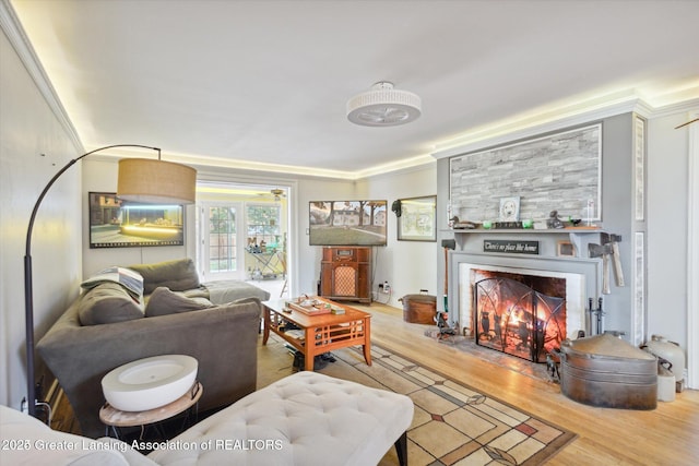 350 N Marshall Ave, Marshall, MI 49068 - living room with a fireplace with flush hearth, light wood-style flooring, and ornamental molding
