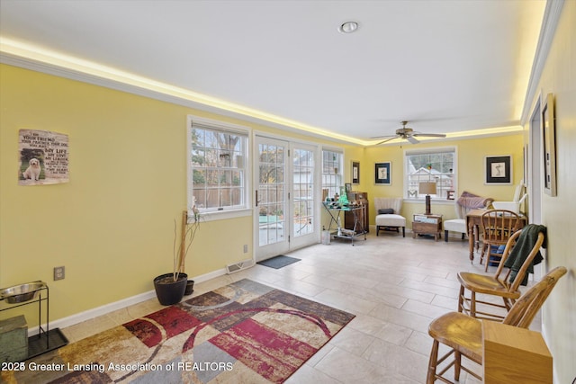 350 N Marshall Ave, Marshall, MI 49068 - sitting room featuring a tray ceiling, light tile patterned floors, a ceiling fan, and french doors