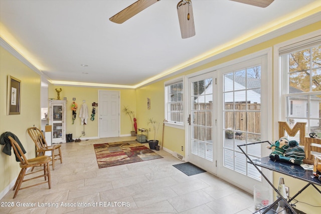 350 N Marshall Ave, Marshall, MI 49068 - entryway with a ceiling fan and crown molding